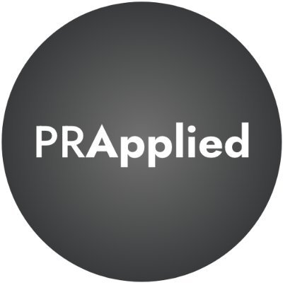 Surrogate-constructed scalable-circuits adaptive variational quantum eigensolver in the Schwinger model